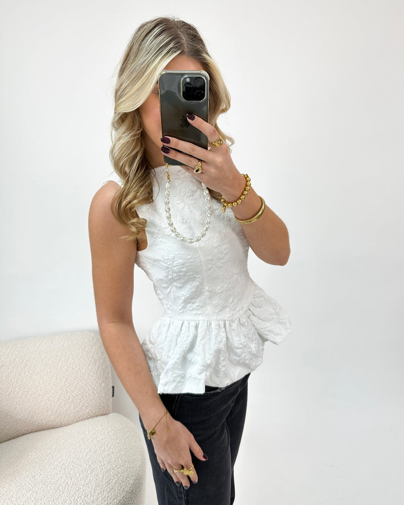 Witte gestructureerde peplum top