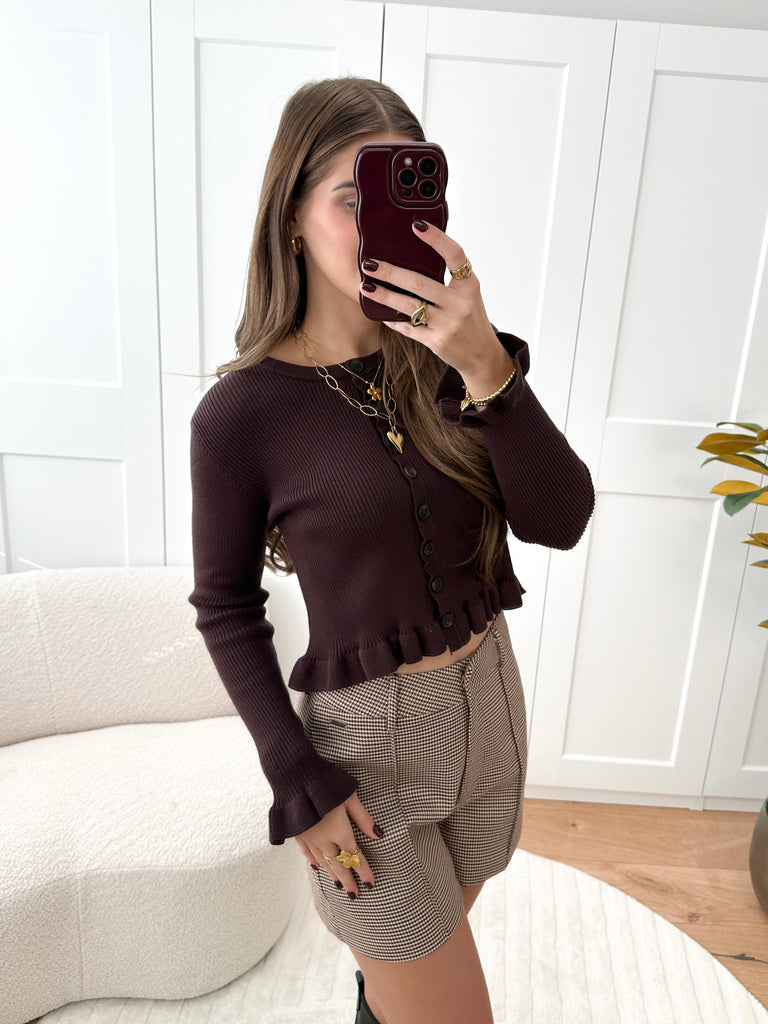 Bruien geribde top met lange mouwen, ruffles en knoopsluiting