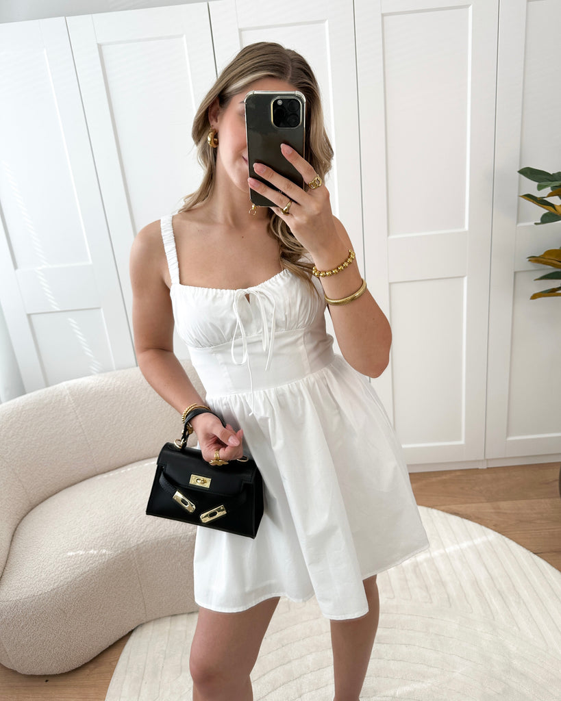 Wit katoenen corset jurkje met strik detail